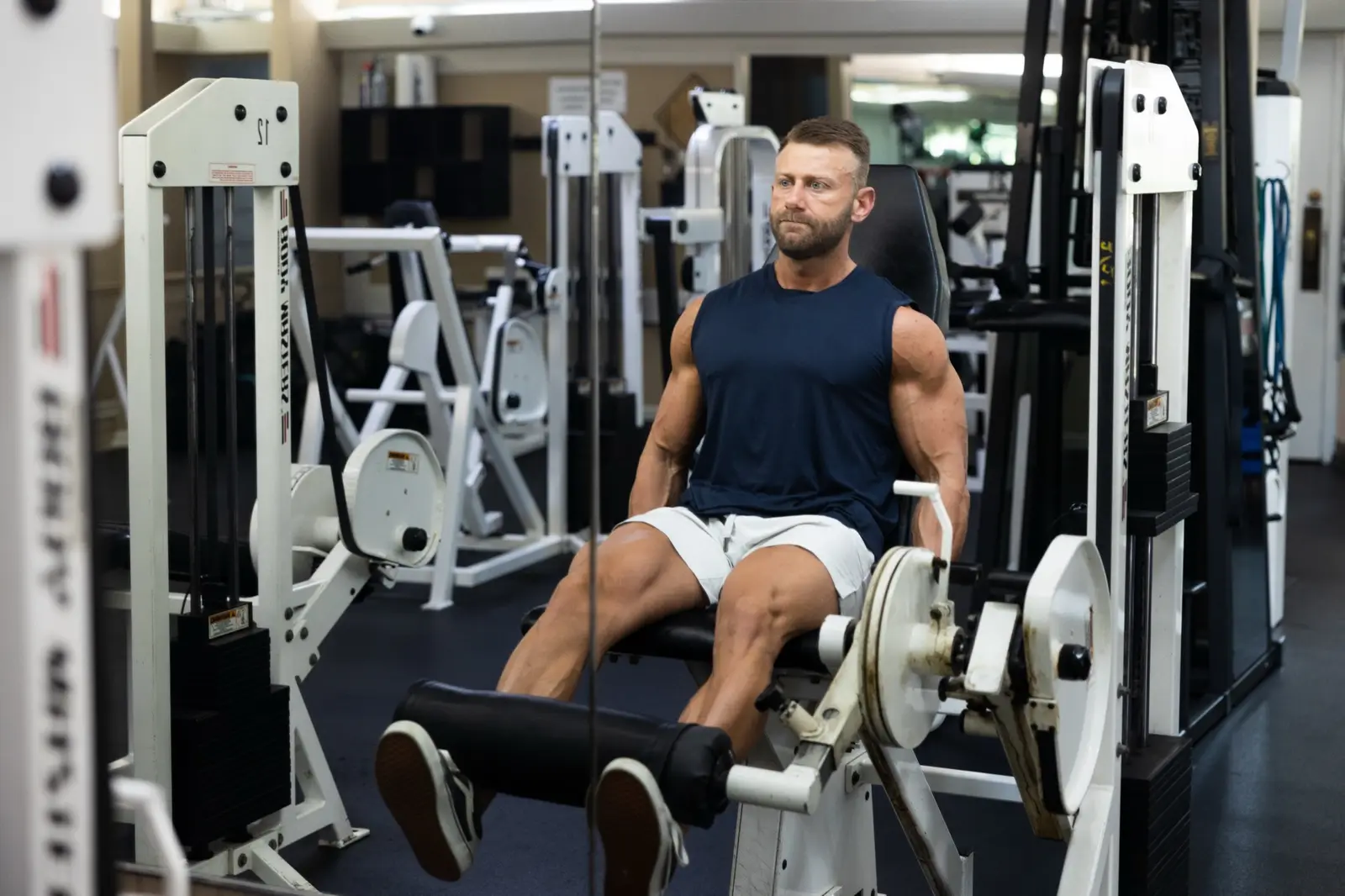 Leg extension machine, wide shot